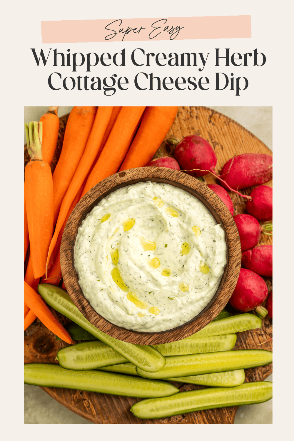 Cottage cheese dip in a wooden bowl surrounded by cut vegetables. There is a frame on the image with Pinterest-optimised text.