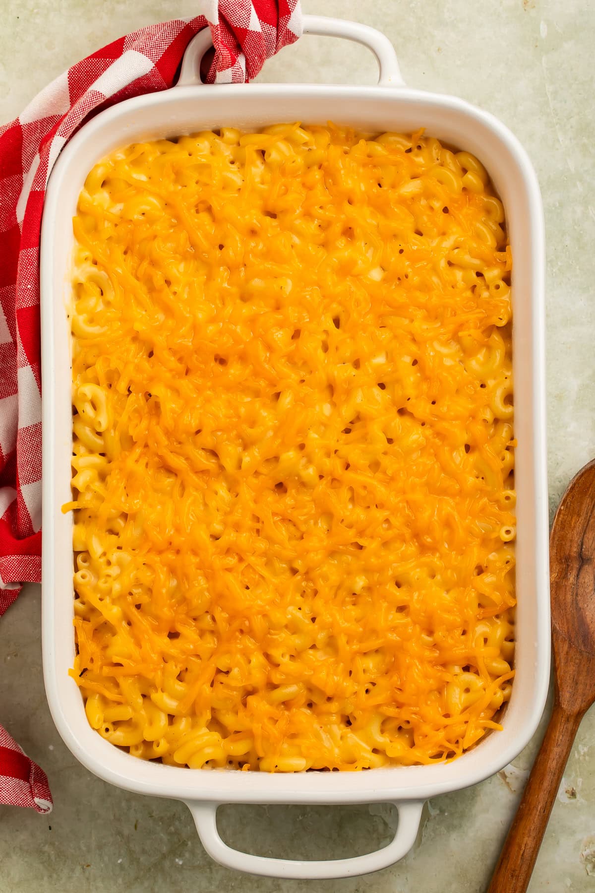 Overhead image of a white dish of baked macaroni and cheese.
