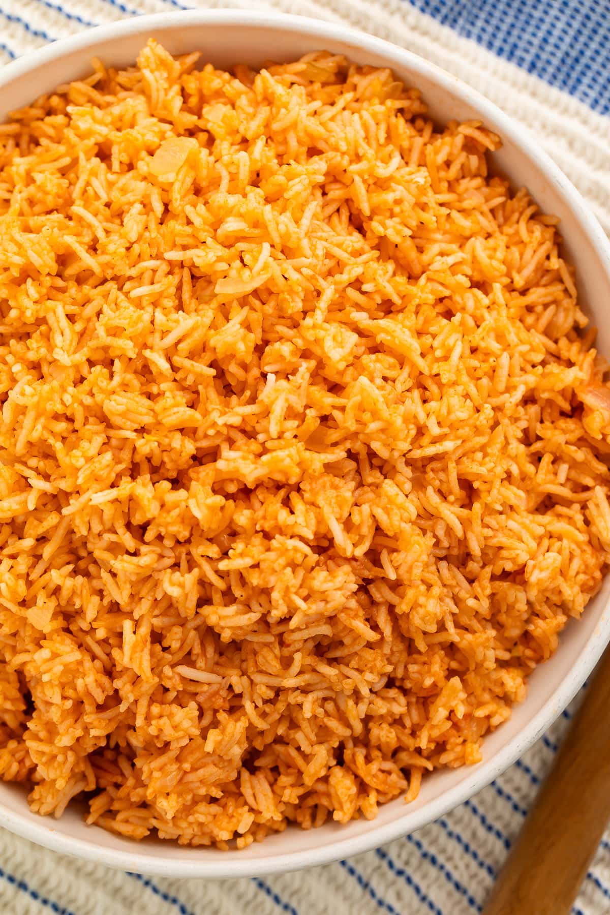 White bowl of Spanish rice pictured from above.