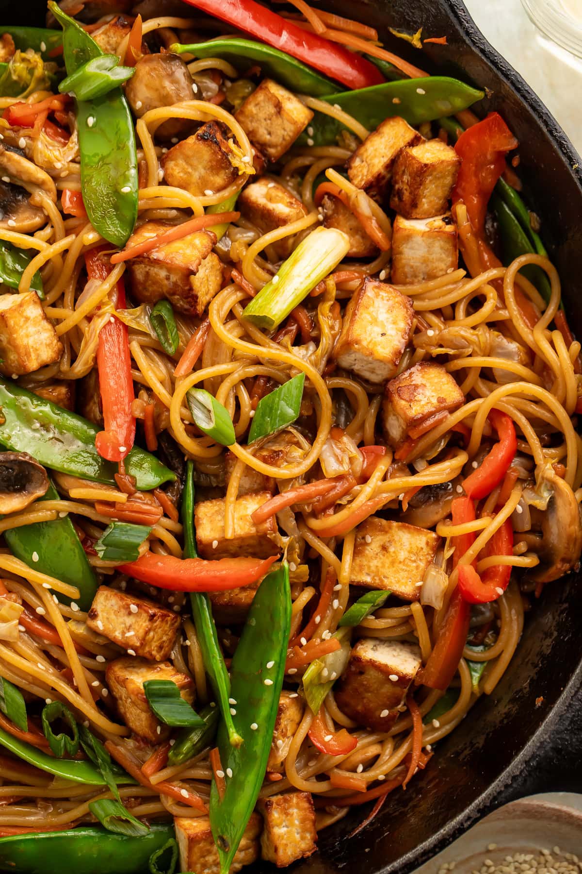 Close up of a skillet of tofu lo mein.
