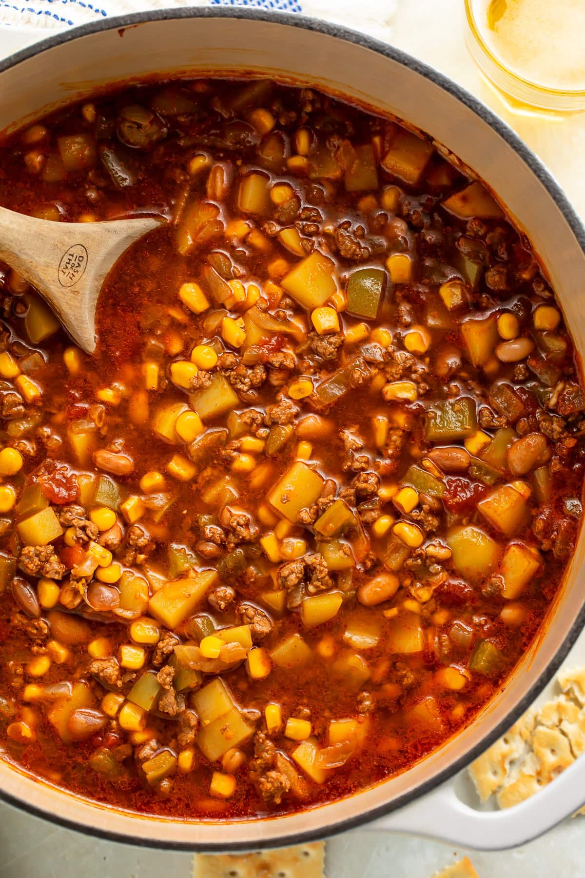 Wooden spoon in a pot of Cowboy soup.