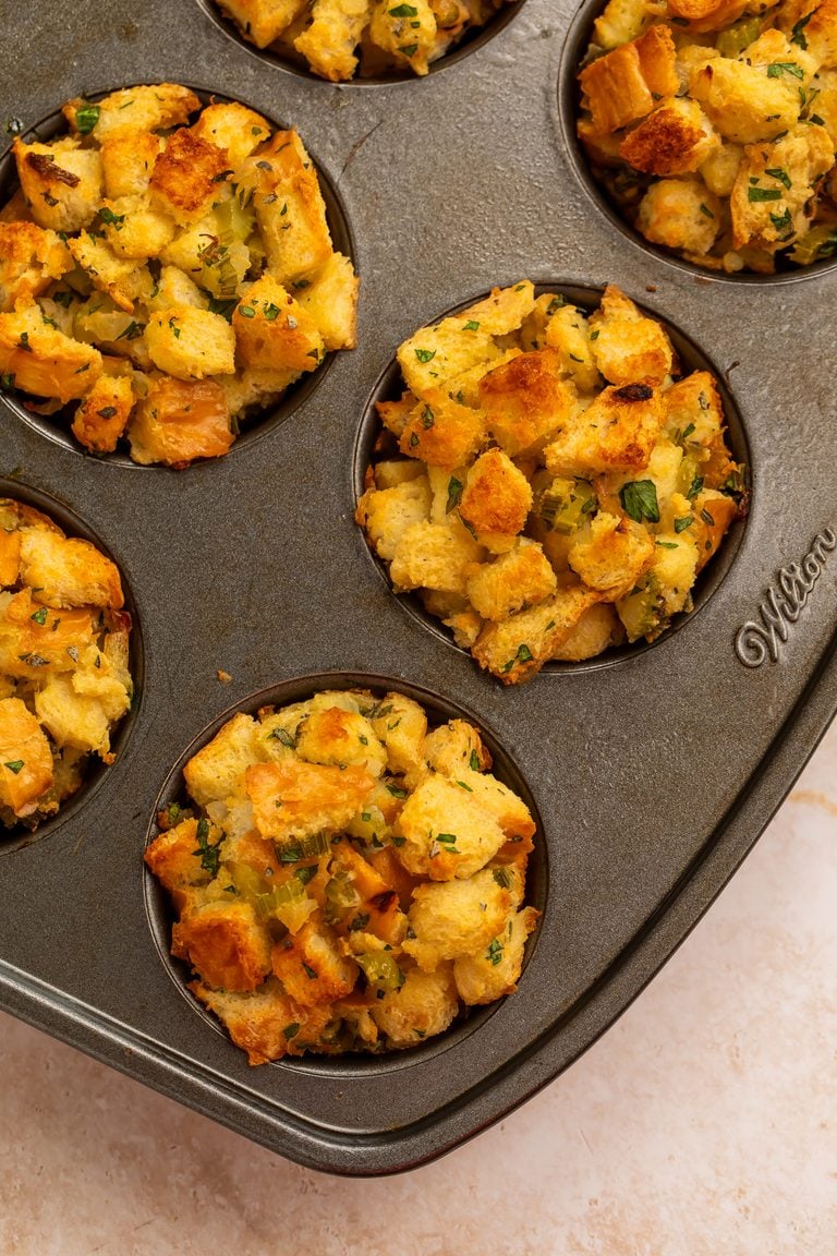 Stuffing muffins pictured in a muffin tin.